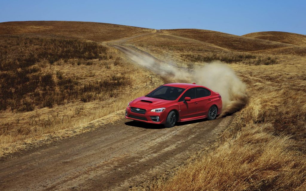 Red 2016 Subaru WRX Speeding Through Dirt