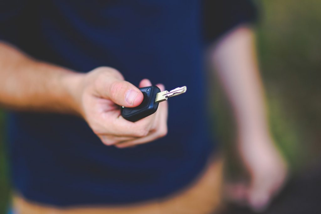 Holding Key to Used Car