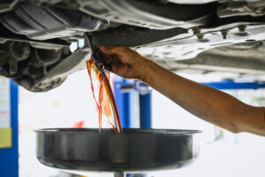 oil coming out of car into oil pan