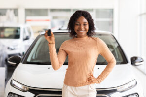women holding new car keys