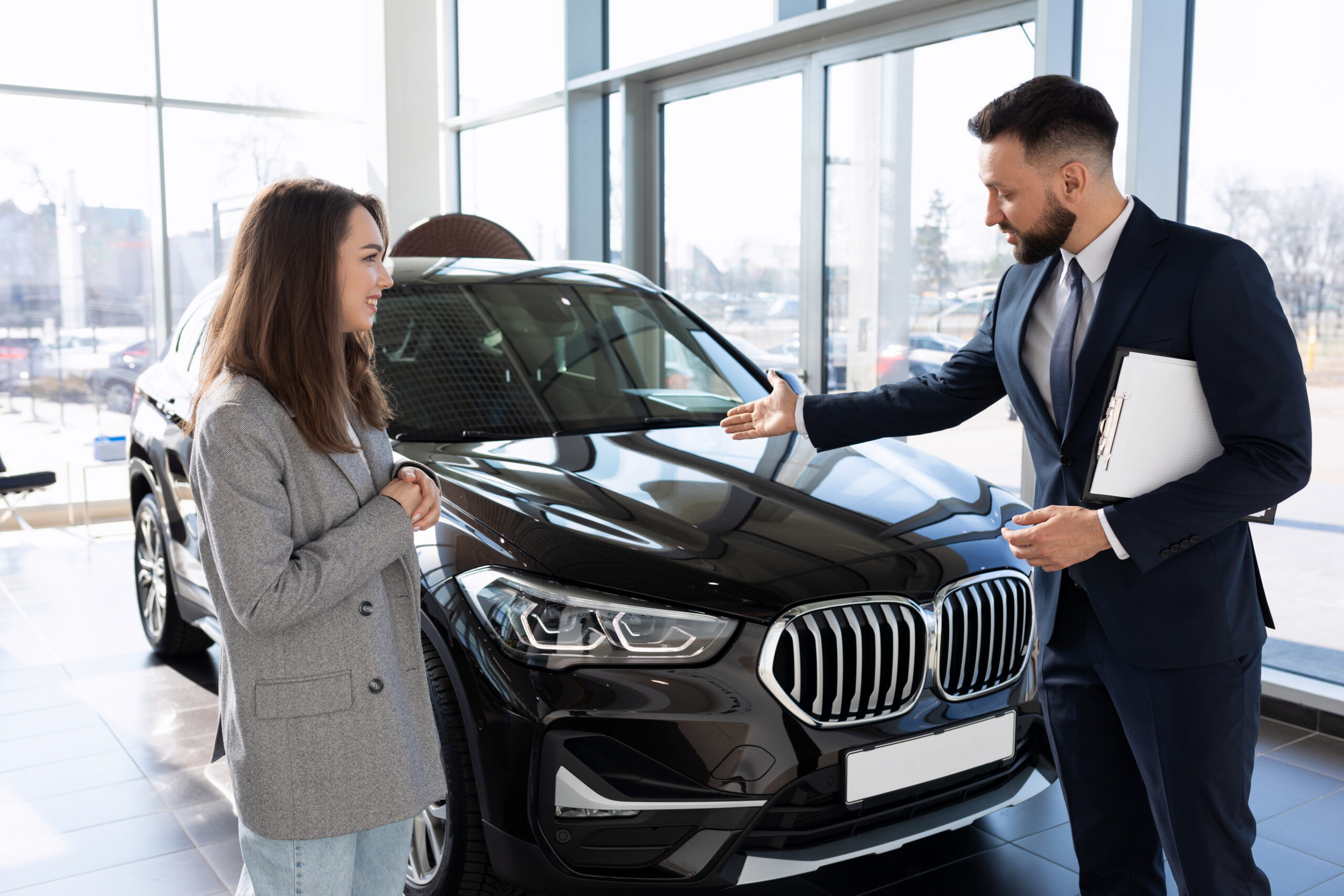 Man and women around bmw SUV