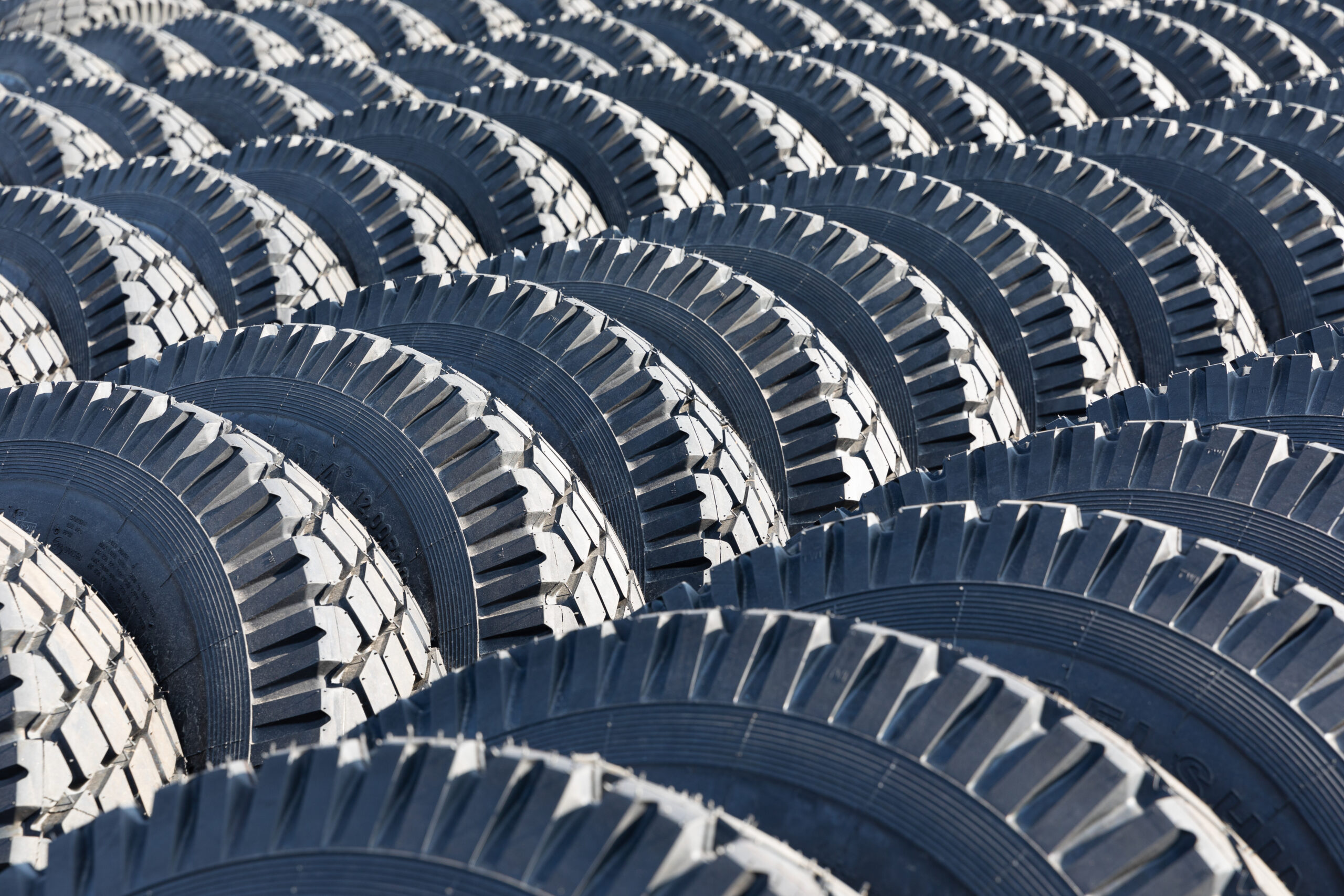 Photo of black big tires on wheels for large cars